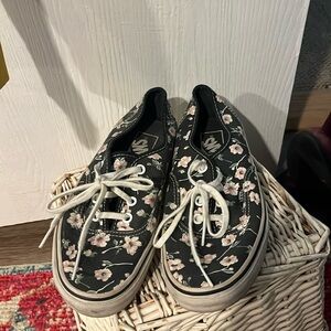 Pink flowered dark gray Vans. Size 5.5 youth/7 women’s.